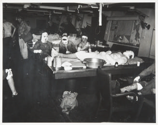 Untitled (Ward room of USS Suwannee being used as emergency sick bay)