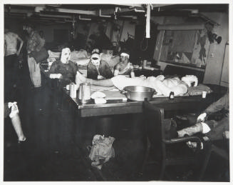 Untitled (Ward room of USS Suwannee being used as emergency sick bay)