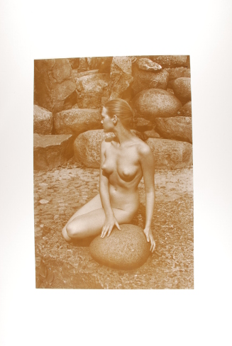 Nude Holding Rock