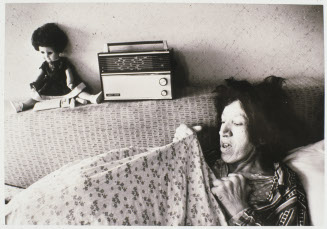 Untitled (Woman on a couch with radio and doll)