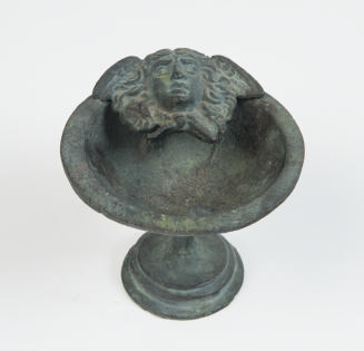(Small stemmed chalice with winged Medusa head applique)